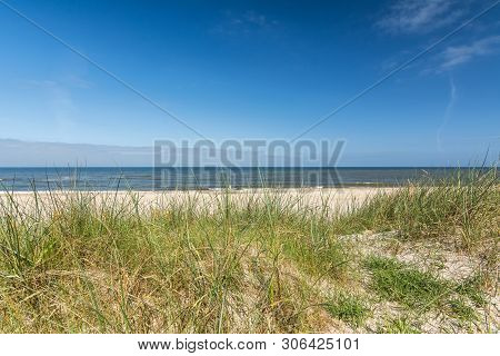 View Of The Ocean Through Dune Landscape