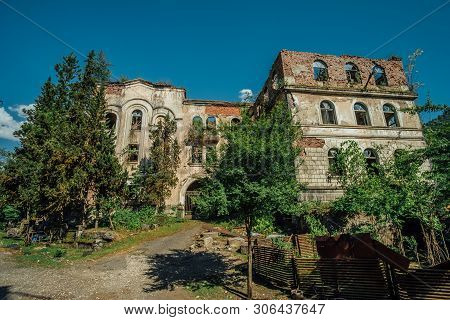 Ruined Overgrown Hospital In Ghost Mining Town Akarmara, Consequences Of War In Abkhazia, Green Post