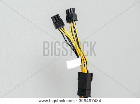 Detail Of New Power Adapter Cable Dongle Splitter Against Gray Background - Cable Used In Computers,