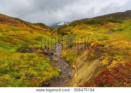 View Of The Eastern Mountain Covered By Clouds, Jelizevo District, Peninsula Kamchatka. Stream Flowi