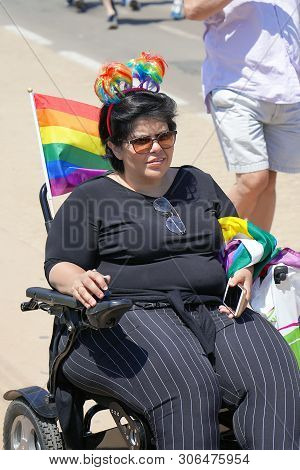 The Annual Parade Lgbt. Woman Lesbian In The Gay Pride Parade. Parade Of Tolerance. Rainbow Flags At