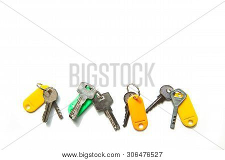 Set Of Many Different Keys Isolated On White Background, Keys With Blank Name Tags, Space For Text. 