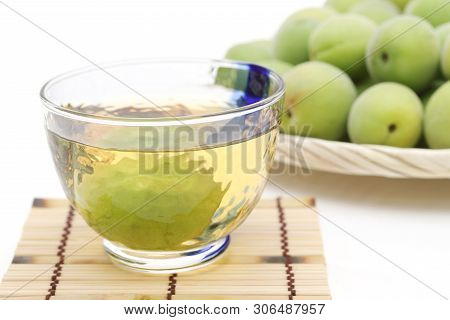 Japanese Plum Wine Called Umeshu On White Background