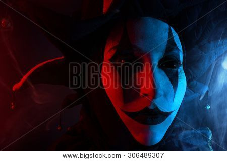 Creepy Jester's Face With Black Eyes, Close-up.
