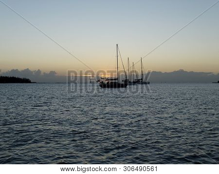 A Tropical Sunrise Seascape With Yachts At Anchor In The River Mouth With Calm Seas At Bundaberg, Qu