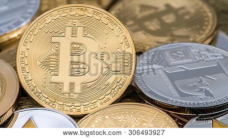 Physical Metal Golden Bitcoin Currency Rotating Over Others Coins. Btc
