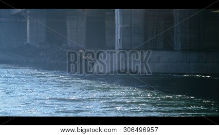 Supports Of An Automobile Bridge. Concrete Supports. Urban Landscape. Under The Bridge. Grunge Backg