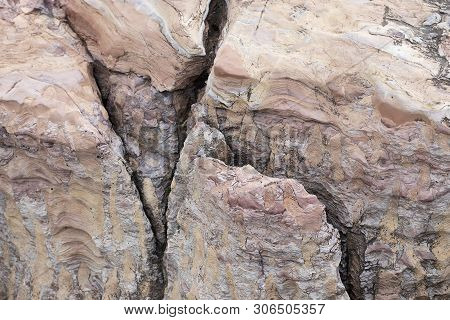 The Rock Is Red With A Rift. The Crack In The Stone, A Piece Of A Broken Stone Brown Color. Red Ston