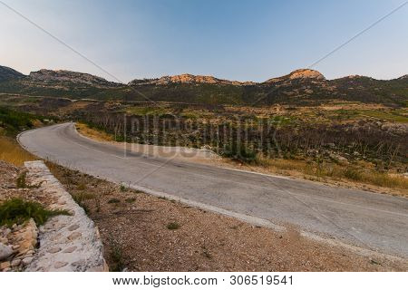 Road To Small Village Trstenik In Peljesac Peninsula, With Mountins And Blue Sky As Background