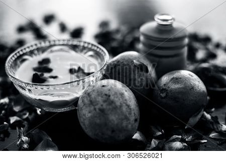 Face Pack For Cheeks On Wooden Surface Consisting Of Sapodilla Or Chikoo Well Mixed With Sandalwood