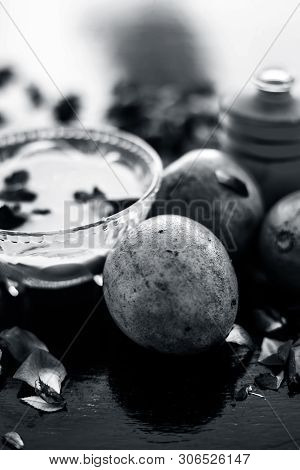 Face Pack For Cheeks On Wooden Surface Consisting Of Sapodilla Or Chikoo Well Mixed With Sandalwood