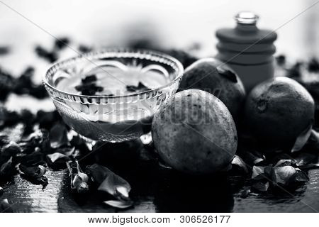 Face Pack For Cheeks On Wooden Surface Consisting Of Sapodilla Or Chikoo Well Mixed With Sandalwood