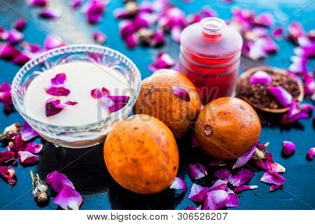Face Pack For Cheeks On Wooden Surface Consisting Of Sapodilla Or Chikoo Well Mixed With Sandalwood