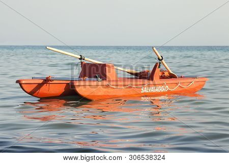 Italian Boat Rescue Lifeguard. A Lifeboat Is In The Water In The Sea. Panorama With Sea And Sky In T