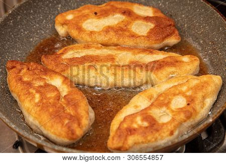 Patties Are Fried In Oil In A Pan .