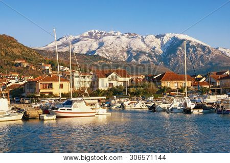 Beautiful Mediterranean Landscape On Sunny Winter Day. Fishing Boats In The Harbor At The Foot Of Th