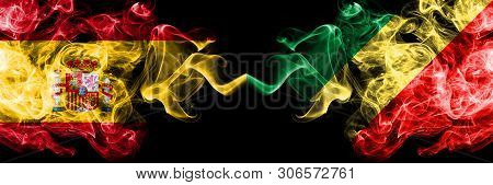 Spain Vs Congo, Congolese Smoky Mystic Flags Placed Side By Side. Thick Colored Silky Smokes Flag Of