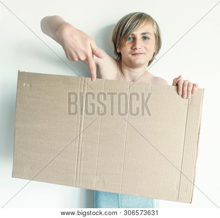 Boy Showing Blank Signboard with Empty Copyspace