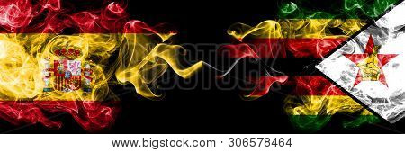 Spain Vs Zimbabwe, Zimbabwean Smoky Mystic Flags Placed Side By Side. Thick Colored Silky Smokes Fla