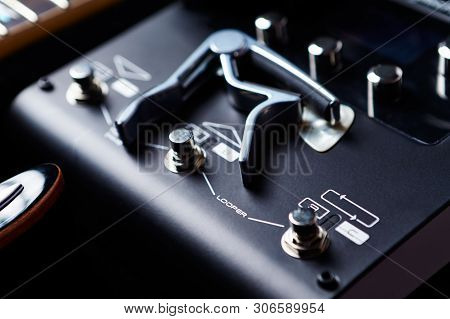 Multieffects Processor For Electric Guitar On Black Background.
