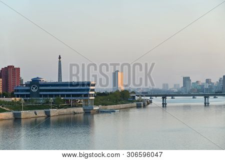 Pyongyang, North Korea - May 2, 2019: City View And Taedong River At Sunset. View On The Modern Yang