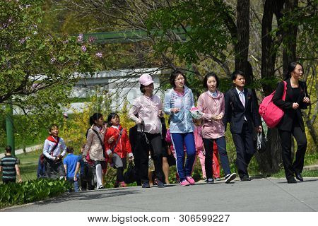 Pyongyang, North Korea - May 1, 2019: People Walking In The Taesongsan Funfair. Is An Amusement Park