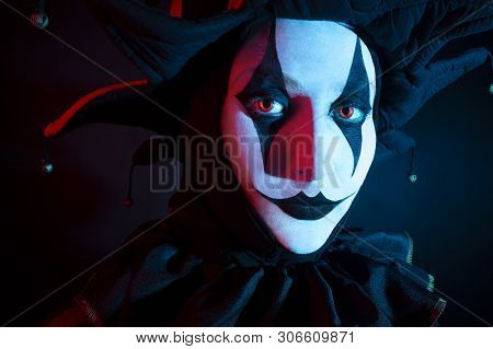 Beautiful Jester Woman's Face, Close-up. Halloween Concept.