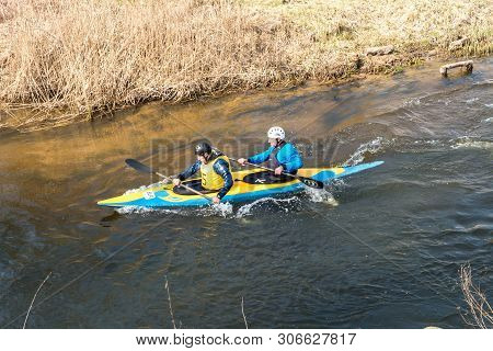 Grodno, Belarus - April, 2019: Kayak Freestyle Competition On Fast Cold Water River Strenuously Rowi