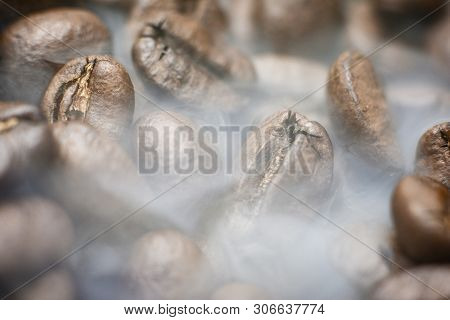 Roasting The Coffee Beans Of Arabica. Coffee And Smoke.