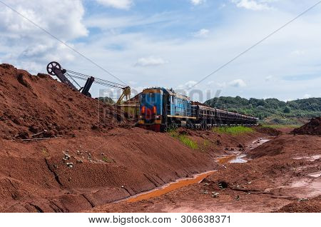Excavator Loading Clay To The Train