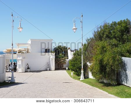White Buildings Of African Touristic Area Near Caves Of Hercules In Morocco With Clear Blue Sky In 2