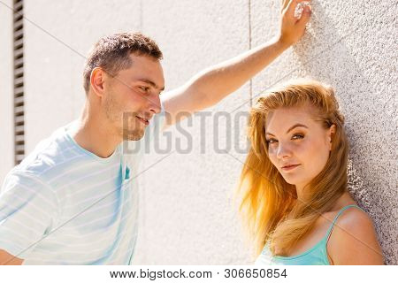 Flirt, Love And Passion Concept. Man Flirting With Attractive Blone Girl On City Street.