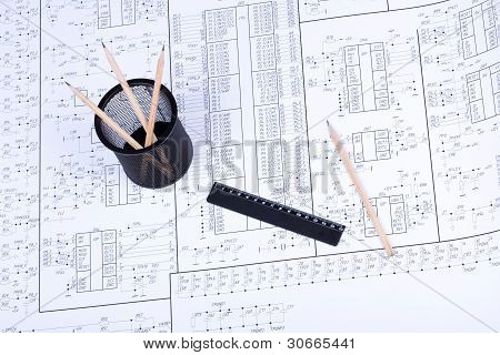 Basket ruler and pencil on drawing of electrical circuits