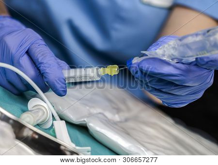 Nurse Preparing Medication For Parenteral Nutrition In A Hospital, Conceptual Image
