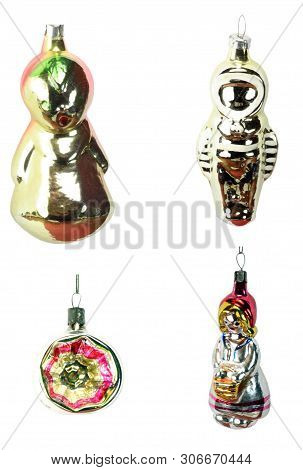 Four Christmas Fir Tree Toys Isolated At Dry Sunny  Day