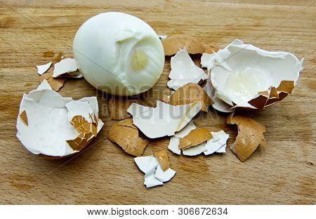 Boiled Egg With Shell On The Wooden Table