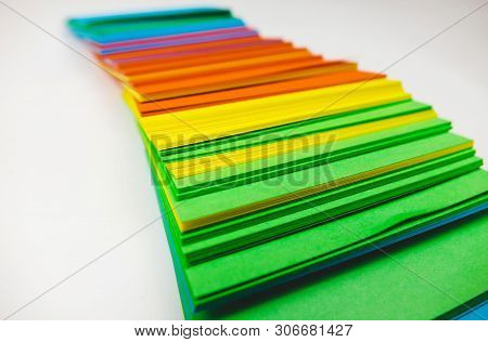 A Stack Of Multicolored Note Papers On An Isolated White Background. Isolates