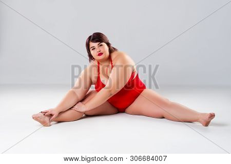 Plus Size Model In Red Lingerie, Fat Woman In Underwear On Gray Background, Body Positive Concept