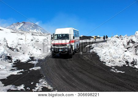 Etna, Sicily, Italy - Apr 9th 2019: Tourist Jeep Or Bus Driving Tourists To The Top Of Etna Volcano 