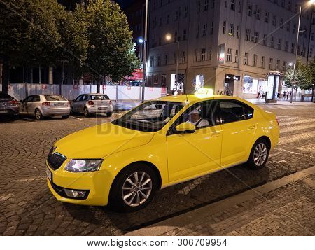 Prague, Czech Republic - June 9 2019: Yellow Cab Or Taxi Waiting On Wenceslas Square, Called Vaclavs