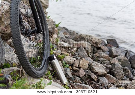 Cyclist In Nature. Bicycle And Flask. Traveling By Bike.
