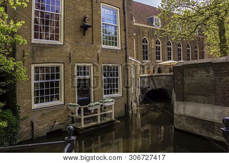 Gouda, Holland, Netherlands, April 23, 2019,  A Bridge In A Street In Gouda Old Town, View Of Museum