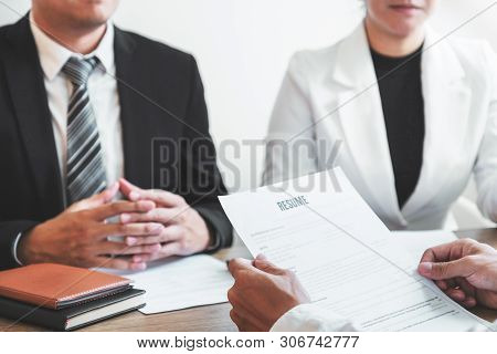 Senior Manager Hr Reading A Resume During A Job Interview Employee Young Man Meeting Applicant And R