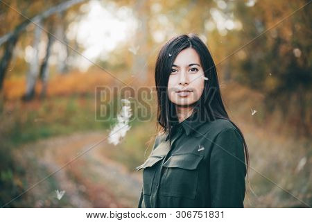 Dreamy Beautiful Girl In Airy White Fluff On Bokeh Background With Yellow Leaves. Inspired Girl In A