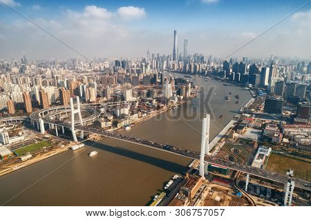 Shanghai Nanpu Bridge over Huangpu River with busy traffic in China.