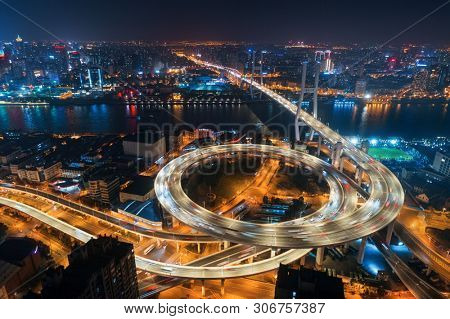 Shanghai Nanpu Bridge over Huangpu River with busy traffic in China.