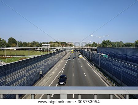 Motorway On The Outskirts Of The City Leaving Under The Bridges