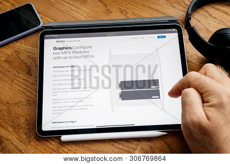 Paris, France - Jun 6, 2019: Man Reading On Apple Ipad Pro Tablet About Latest Announcement Of At De