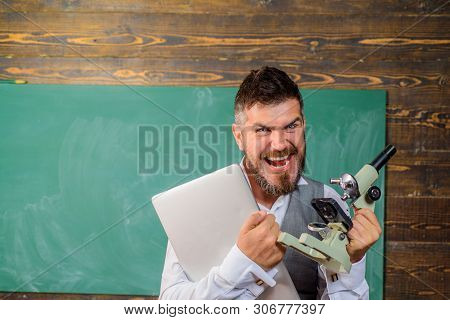 Angry Docent With Laptop And Microscope. University Teacher In Chemistry Or Biology Class. Man With 