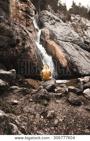 Single Man Standing Near Gollinger Waterfall In Austria. Travel Summer Alps Concept.